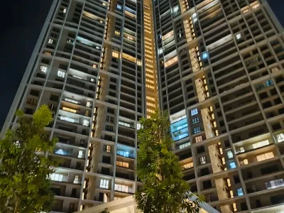 Desa ParkCity luxury condominium high-floor living room window film installation with clear views of the park