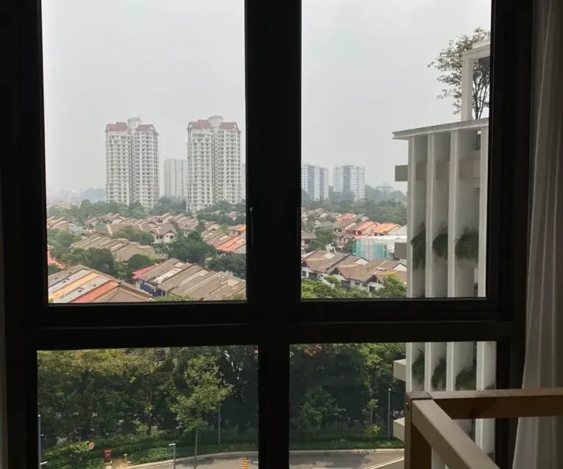 Professional installer installing sputtered architectural window film in Desa ParkCity apartment