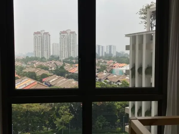 Professional installer installing sputtered architectural window film in Desa ParkCity apartment