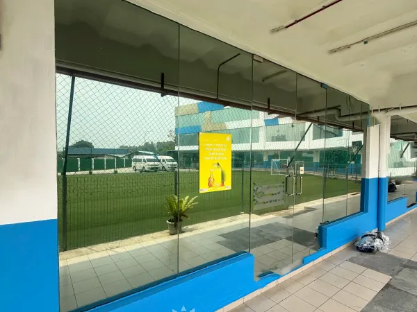 School building exterior glass entrance tinted with reflective solar control privacy window film