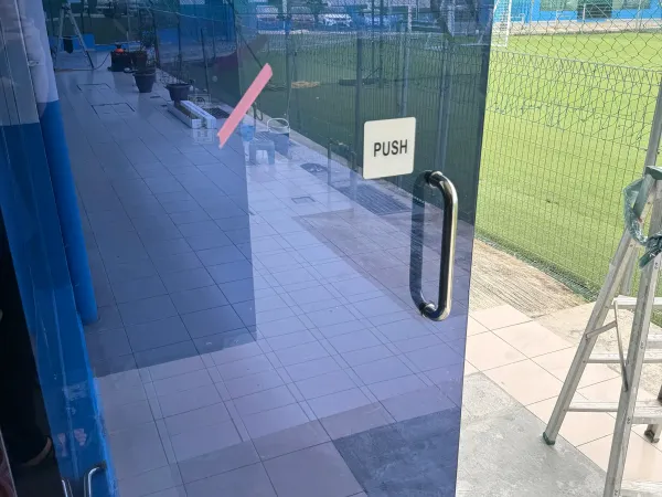 International school glass push door installed with solar heat and glare control window film